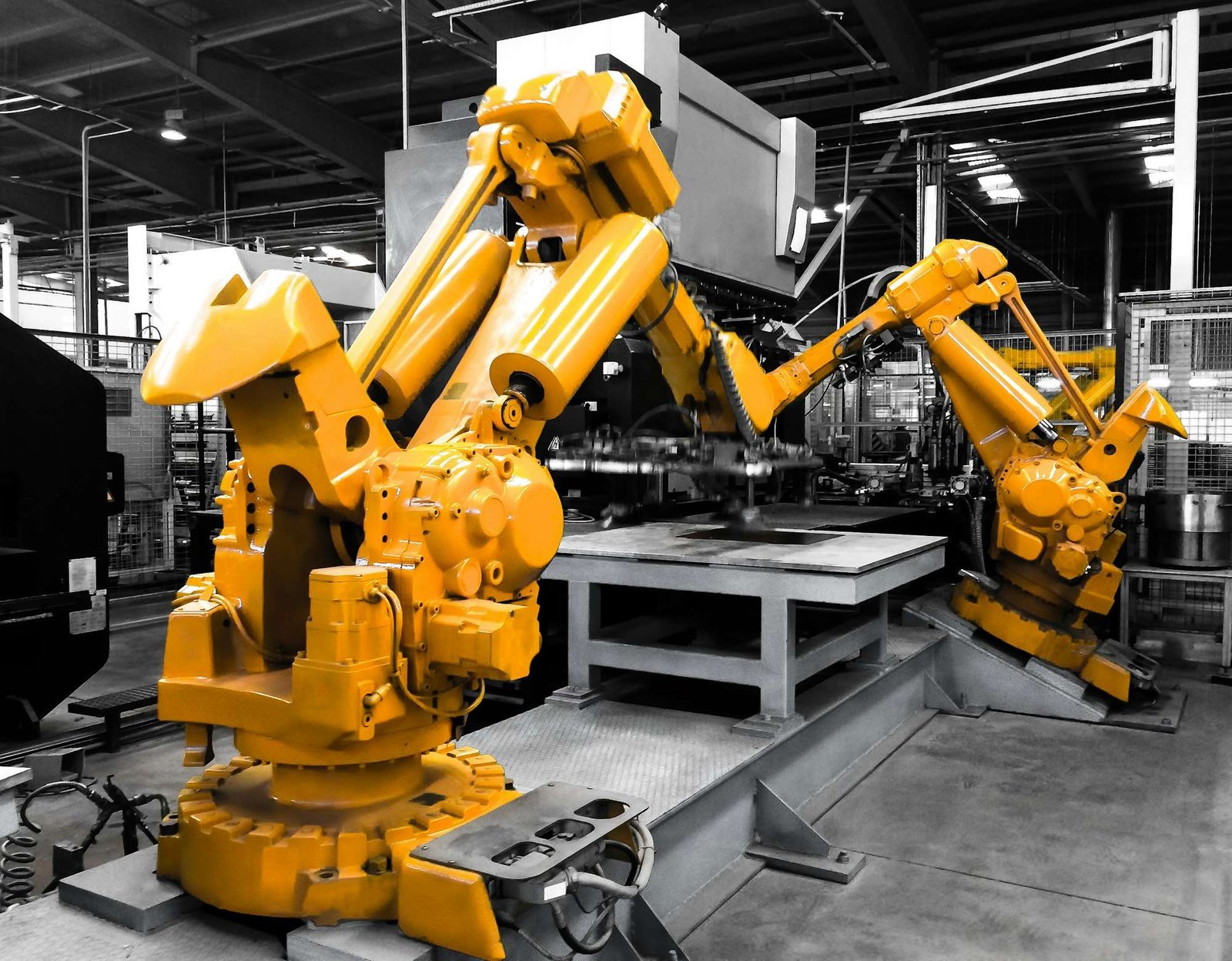 Robotic arms on a factory line. Industrial Next wants AI to cut robot changeover times from weeks to minutes.