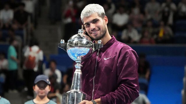 Carlos Alcaraz lifts the Japan Open trophy in Tokyo after beating Jiri Lehecka 7-6, 6-4 in Tuesday's final.