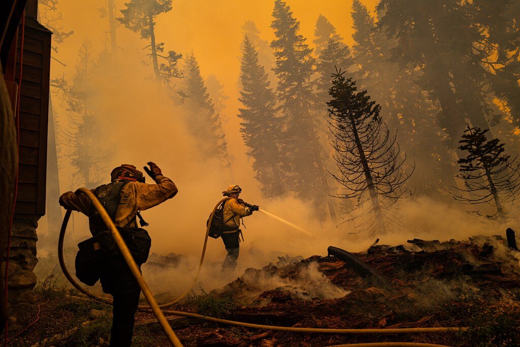 Fire crews battle a wildfire in California. The Bouquet Fire near Santa Clarita is now 71 percent contained.