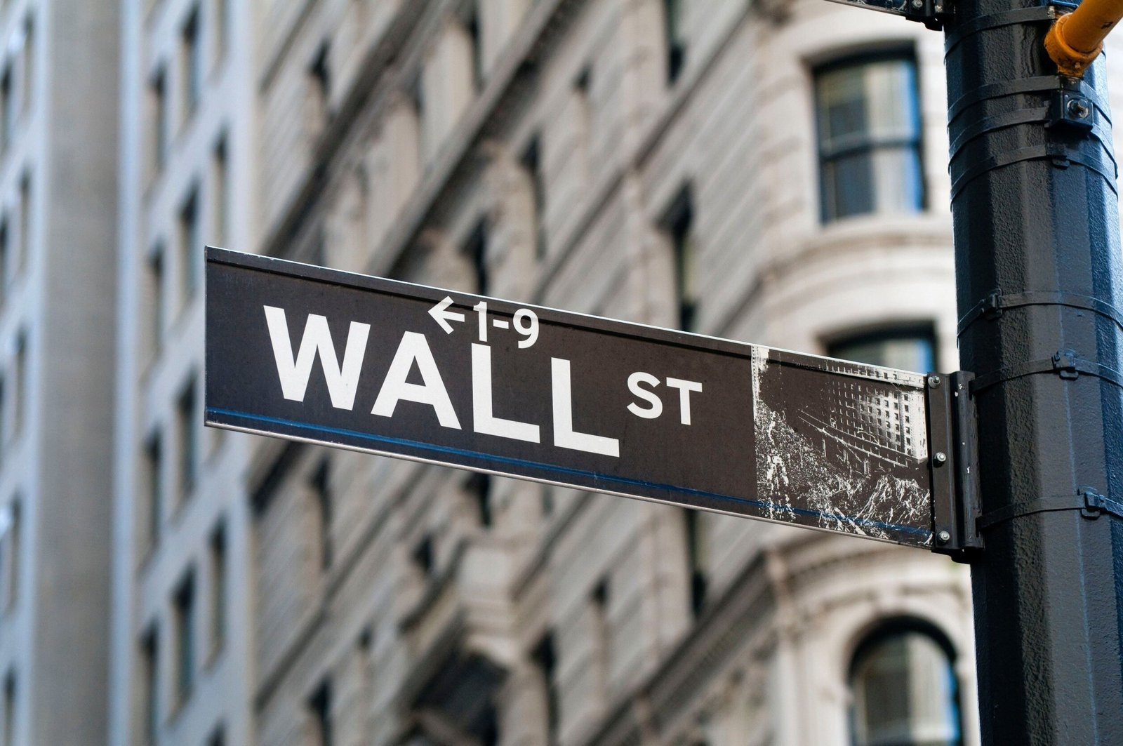 The Wall Street sign in New York. Financial stocks lead the latest MarketBeat stocks-to-watch screener. (File photo)