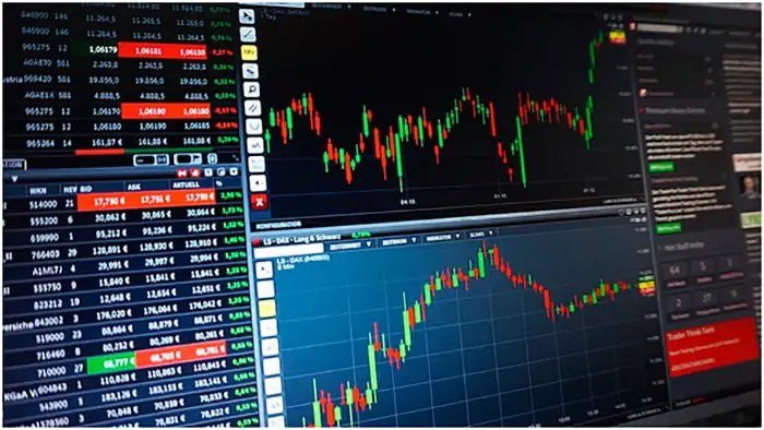 Stock charts on a trading screen. Analyst lists put TDK, Chord Energy and Oracle in focus. (File photo)
