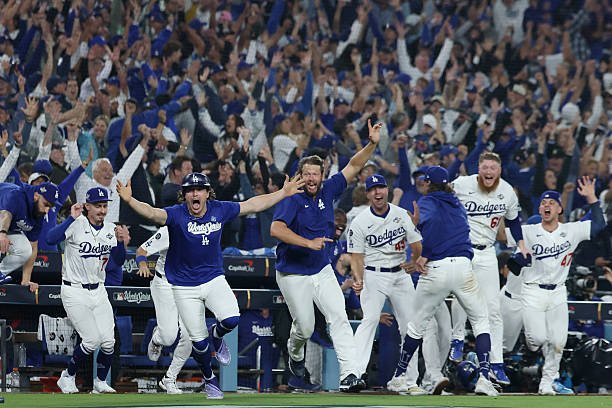 The Dodgers celebrate a postseason win. Los Angeles closed out the Braves in four games to reach the NLCS.