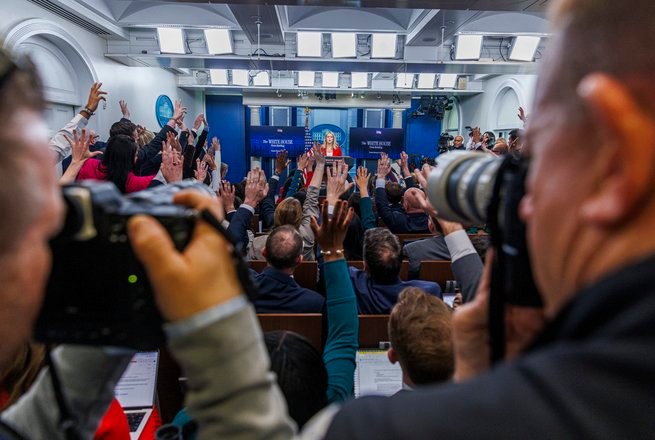 Television cameras in the White House briefing room. The Justice Department is investigating the five-network TV press pool.