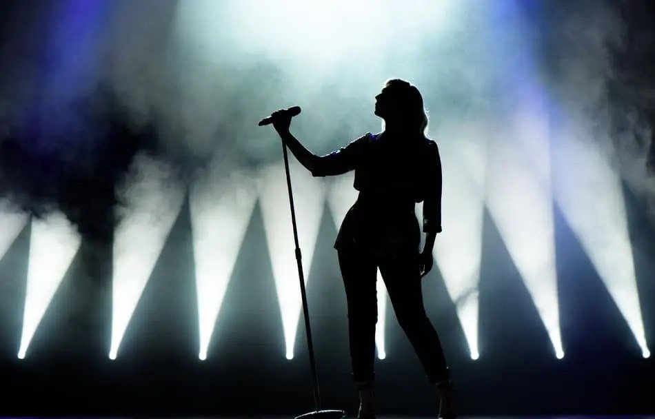 A concert singer performing on stage, for illustration.
