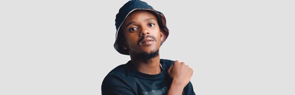 A DJ performs for a crowd at a South African music event.