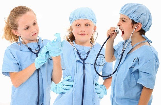 A children's surgical team at work. A card game at the operating-room door is the intervention being tested. (File photo)