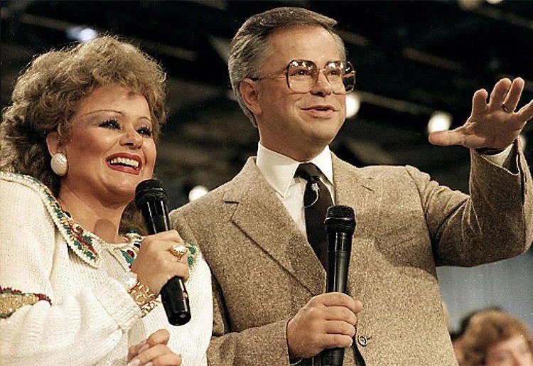 Jim Bakker with then-wife Tammy Faye during a PTL Club broadcast in the 1980s.