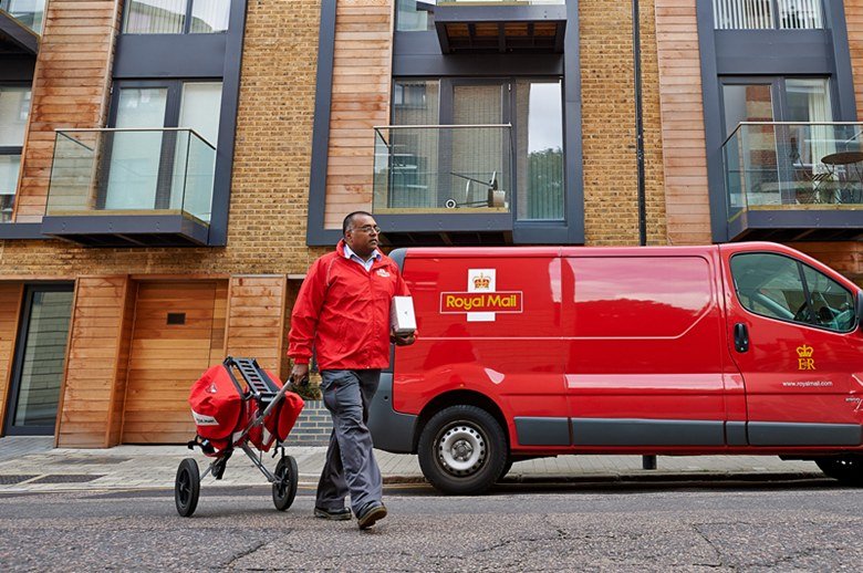 A postal worker on a delivery round; the CWU says Royal Mail is losing about 330 staff a week.