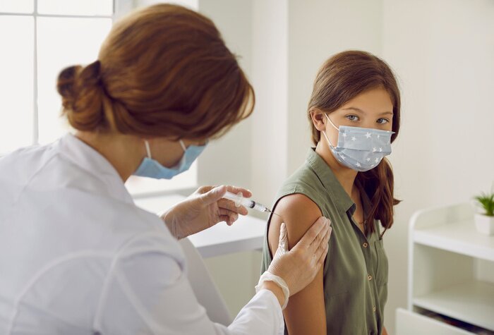 A nurse administers an MMR vaccine at a rural clinic, as New York and Pennsylvania expand vaccination access amid the measles surge.