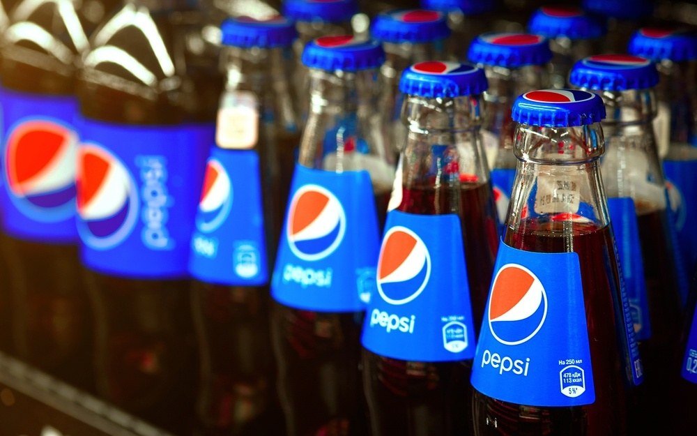 PepsiCo products on shelves; the company cut its annual forecast Thursday on weak North America margins.