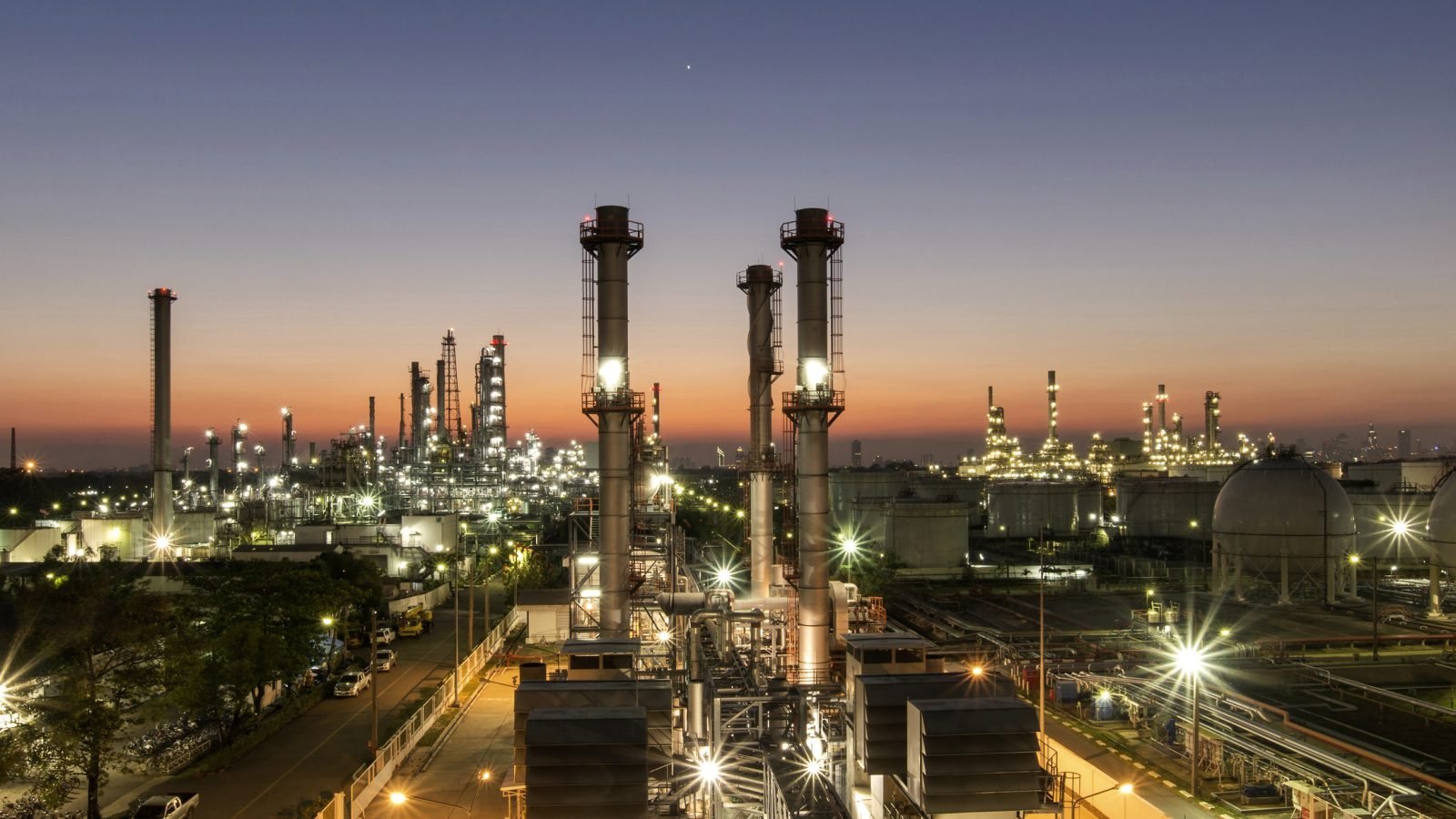 An oil refinery at dusk.