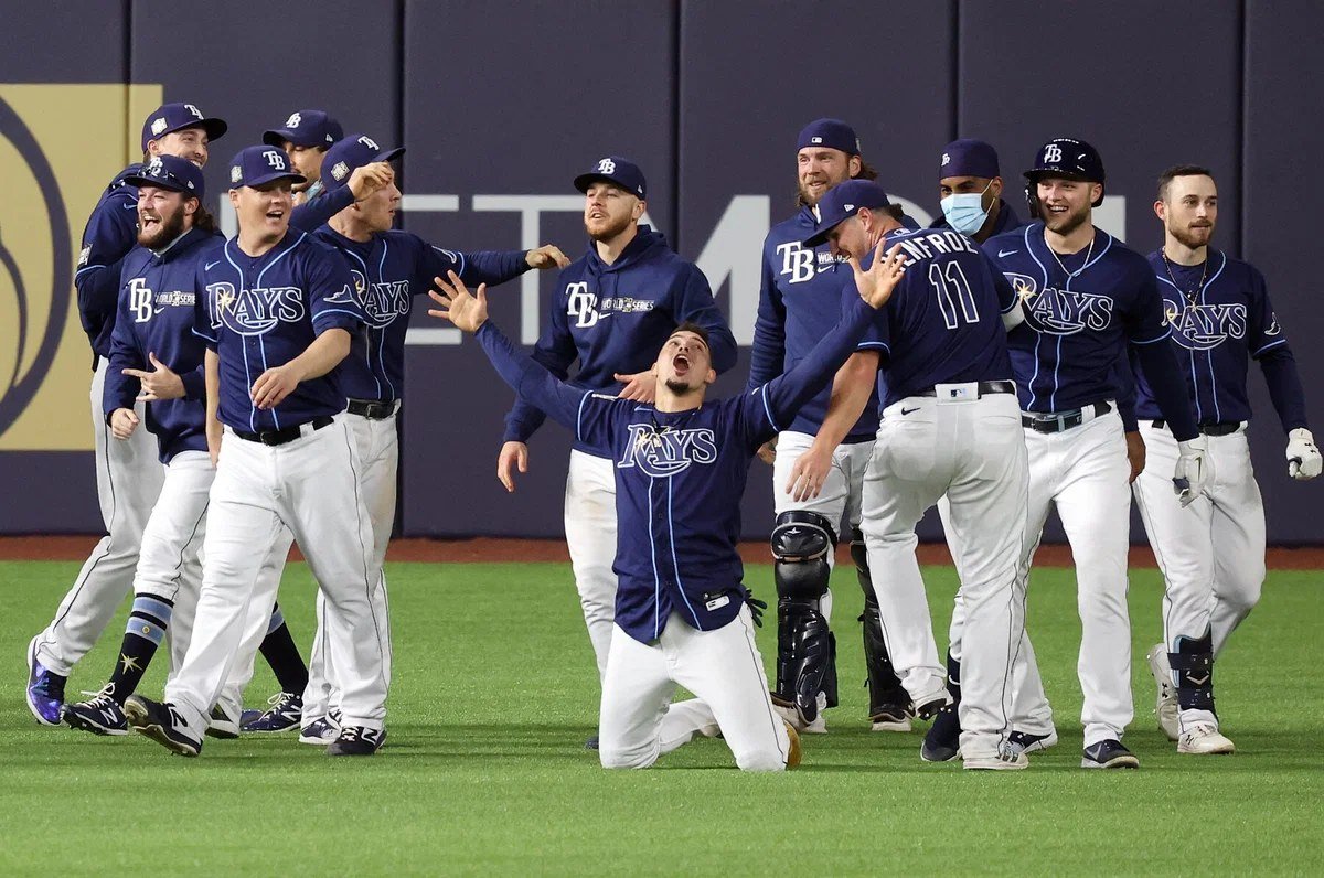 Tampa Bay Rays players celebrate after completing a 3-0 ALDS sweep of the New York Yankees.