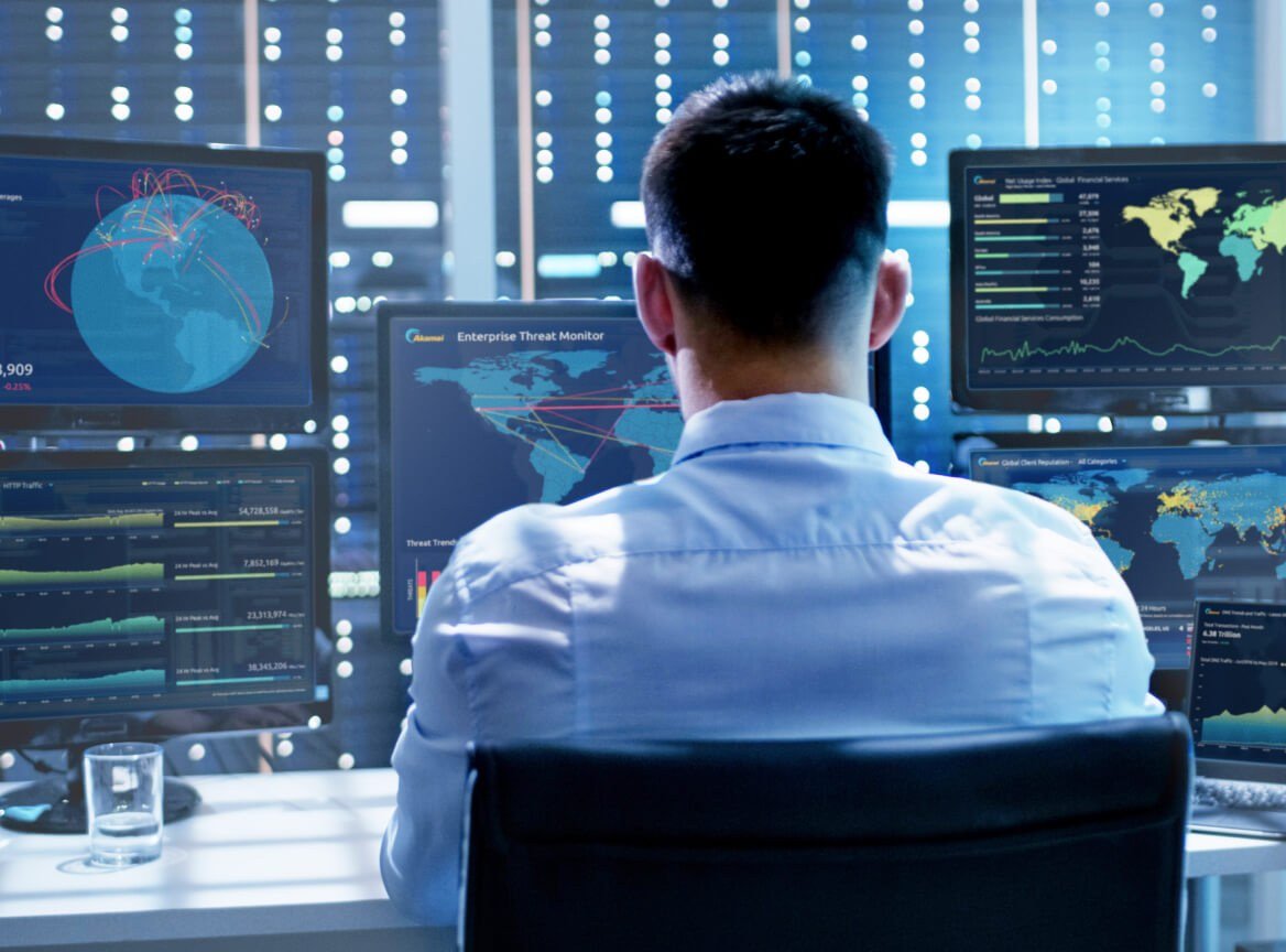 A security operations workspace. U.S. cybersecurity postings fell to a four-year low even as AI security hiring surged.