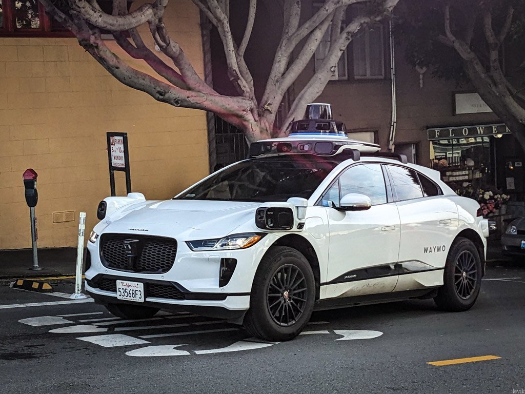 A Waymo self-driving vehicle on a city street.