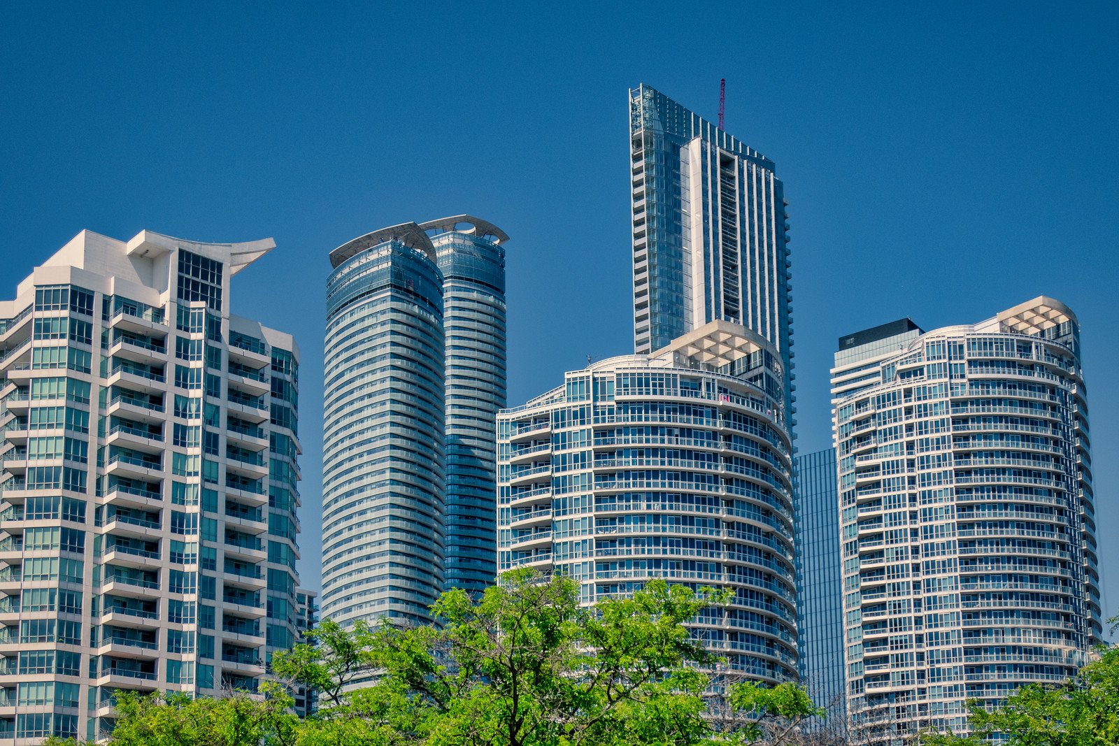 Condominium towers in Toronto, where unsold units are being sold in bulk at deep discounts.