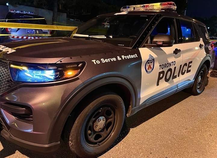 A Toronto police vehicle at night. Police charged two men after Sunday's fatal Scarborough collision.