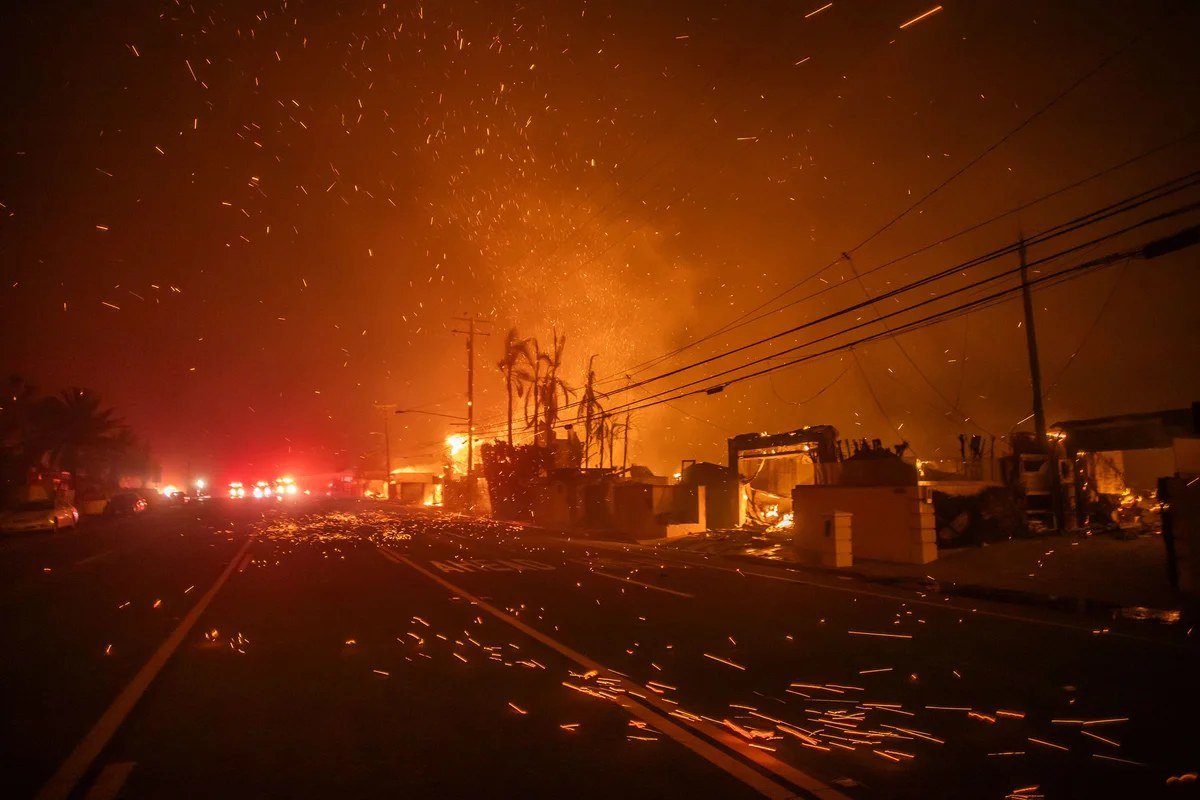Strong winds blow embers during a California wildfire. Forecasters warn of elevated fire weather through Saturday.