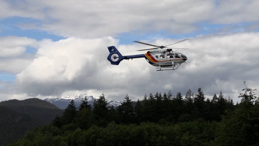 An RCMP helicopter in flight over British Columbia.