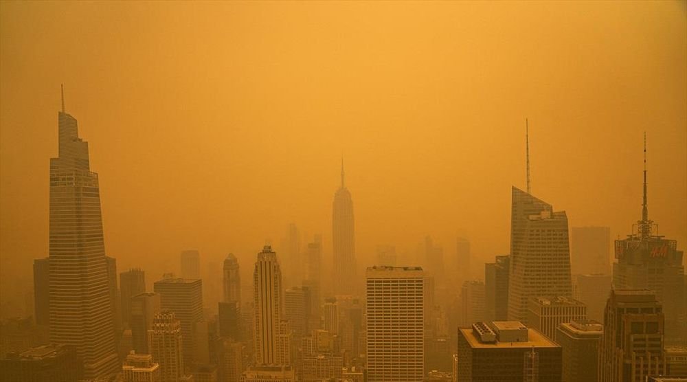 Thick haze over a city skyline, in file imagery.