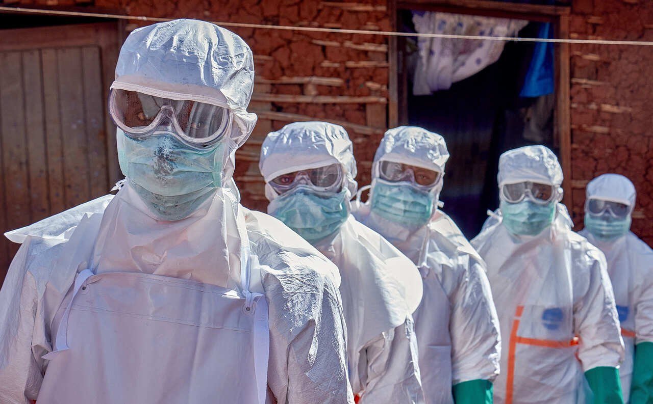 Health workers in protective equipment during an Ebola response in central Africa.