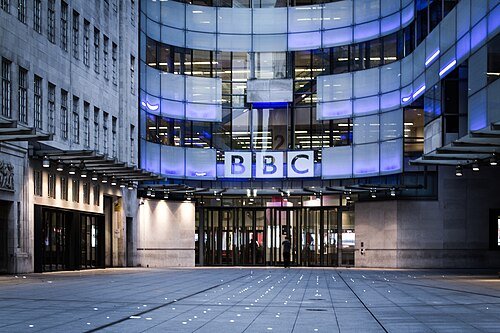 Broadcasting House in London, the BBC's headquarters; the broadcaster is cutting more than 100 news roles in a £500 million savings drive.