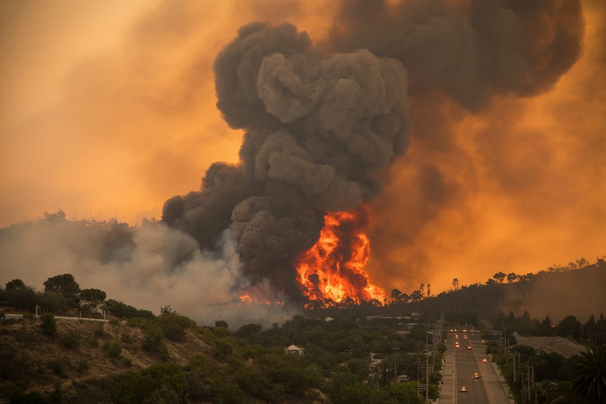A wildfire burning in Orange County, California, where the Norte Fire forced thousands to evacuate.